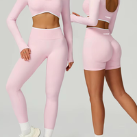 Two individuals wearing pink athletic outfits on a gray background